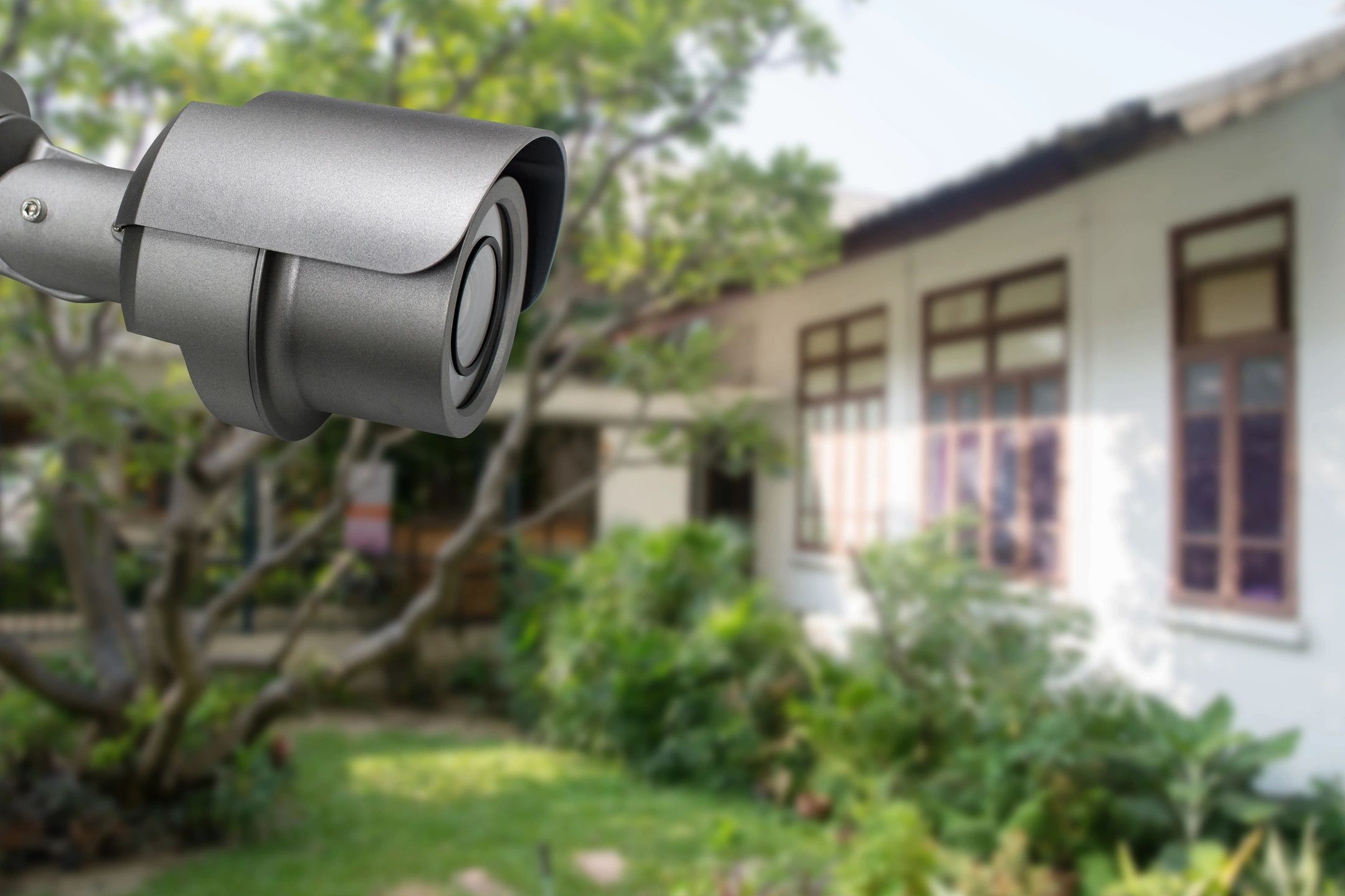 Security camera mounted on house